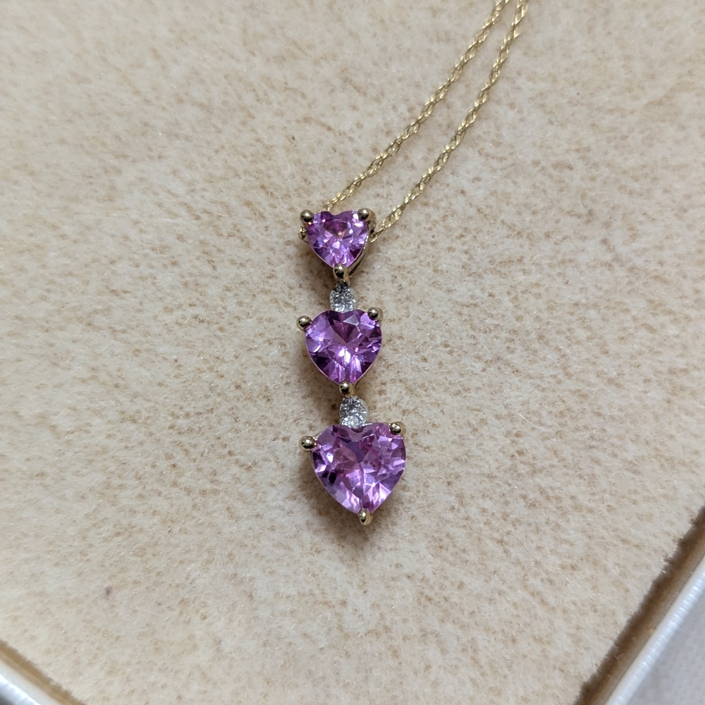 Elegant Gold Necklace with Pink Heart Pendants